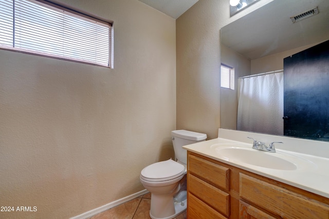 bathroom with toilet, tile patterned floors, visible vents, a textured wall, and vanity