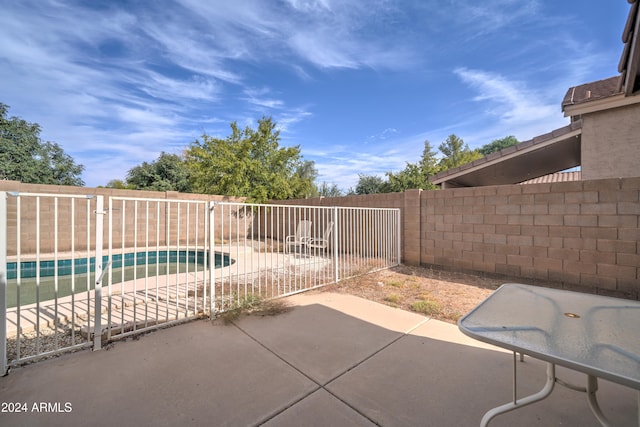 view of patio / terrace featuring a fenced in pool