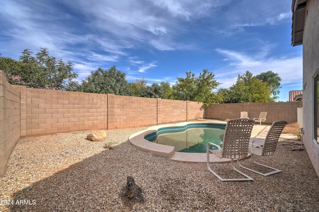 view of pool with a fenced backyard and a fenced in pool