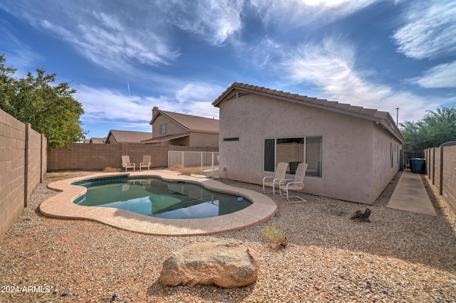view of pool featuring a patio area, a fenced in pool, and a fenced backyard