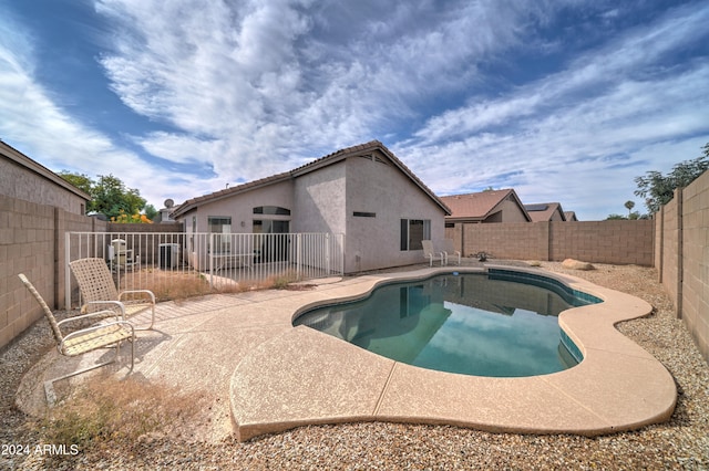 view of swimming pool with a patio area