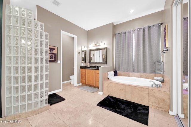 3335 W Carriage Dr, Phoenix, AZ 85086 - bathroom featuring a garden tub, vanity, tile patterned flooring, visible vents, and toilet