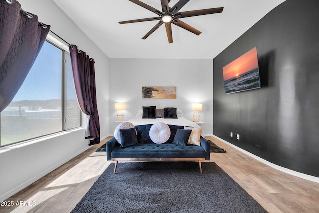 3335 W Carriage Dr, Phoenix, AZ 85086 - bedroom with ceiling fan, baseboards, and wood finished floors