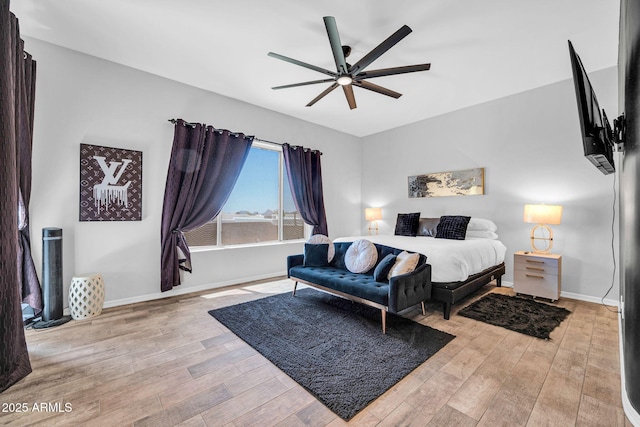 3335 W Carriage Dr, Phoenix, AZ 85086 - bedroom with baseboards, a ceiling fan, and wood finished floors