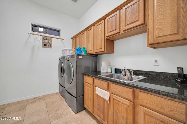 3335 W Carriage Dr, Phoenix, AZ 85086 - laundry area featuring baseboards, washing machine and clothes dryer, a sink, and cabinet space