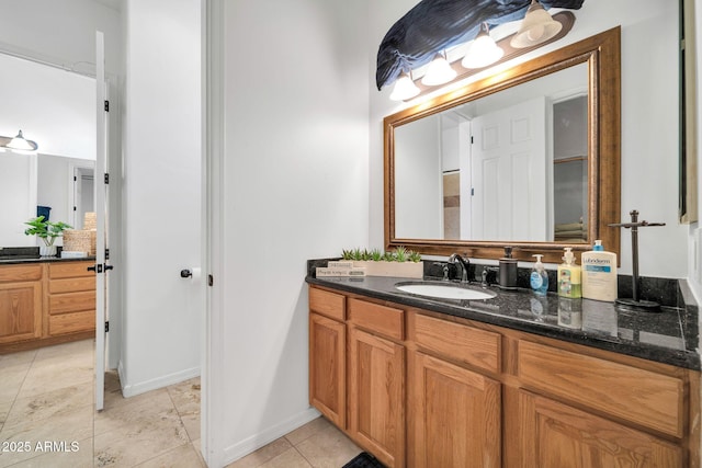 3335 W Carriage Dr, Phoenix, AZ 85086 - bathroom with tile patterned floors, vanity, and baseboards