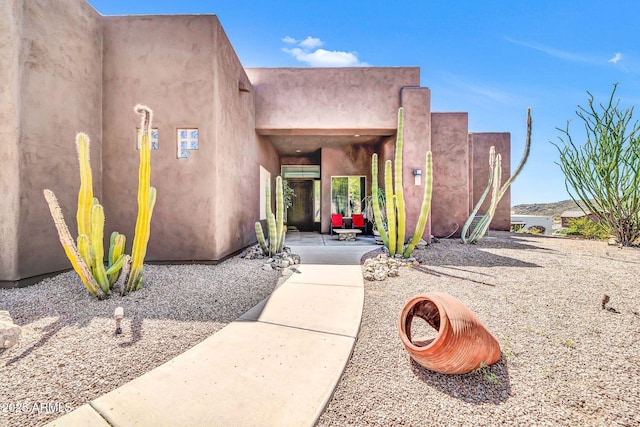 3335 W Carriage Dr, Phoenix, AZ 85086 - entrance to property featuring a patio area, stucco siding, and a wall unit AC