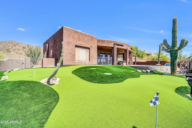3335 W Carriage Dr, Phoenix, AZ 85086 - rear view of house with stucco siding and fence