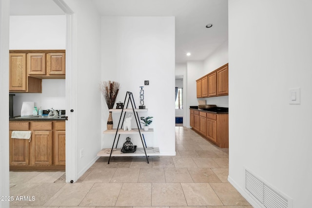 3335 W Carriage Dr, Phoenix, AZ 85086 - hall featuring visible vents, baseboards, a sink, recessed lighting, and light tile patterned flooring