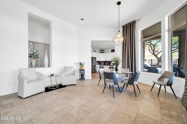3335 W Carriage Dr, Phoenix, AZ 85086 - dining area featuring baseboards, recessed lighting, and a high ceiling