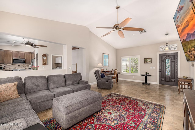 14819 W Lupine Ln, Surprise, AZ 85374 - living room with ceiling fan, baseboards, and high vaulted ceiling