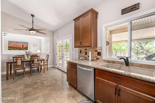 14819 W Lupine Ln, Surprise, AZ 85374 - kitchen featuring dishwasher, a sink, french doors, vaulted ceiling, and baseboards