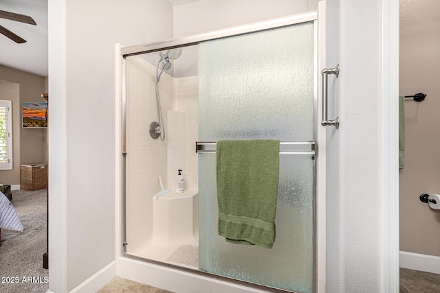 14819 W Lupine Ln, Surprise, AZ 85374 - bathroom featuring a shower stall, ceiling fan, and baseboards