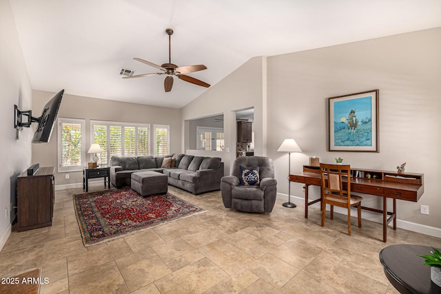 14819 W Lupine Ln, Surprise, AZ 85374 - living room with baseboards, ceiling fan, lofted ceiling, and light stone finish floors
