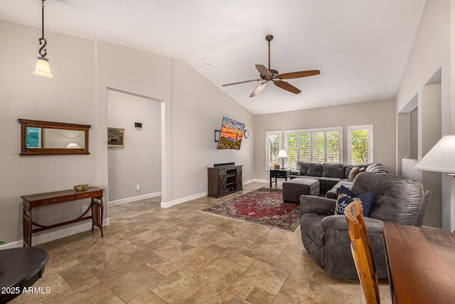 14819 W Lupine Ln, Surprise, AZ 85374 - living area featuring ceiling fan, lofted ceiling, stone tile floors, and baseboards