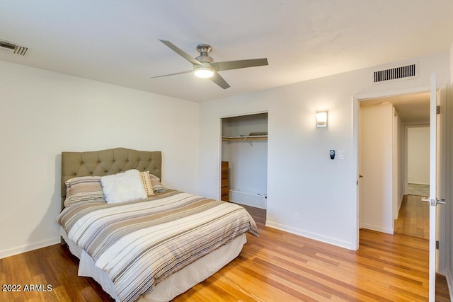 803 W 18th St, Tempe, AZ 85281 - bedroom with light wood-style floors, a closet, baseboards, and ceiling fan