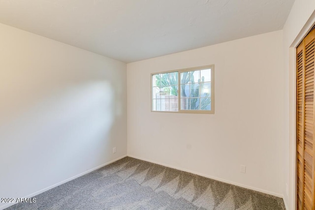 803 W 18th St, Tempe, AZ 85281 - unfurnished bedroom with carpet floors, a closet, and baseboards