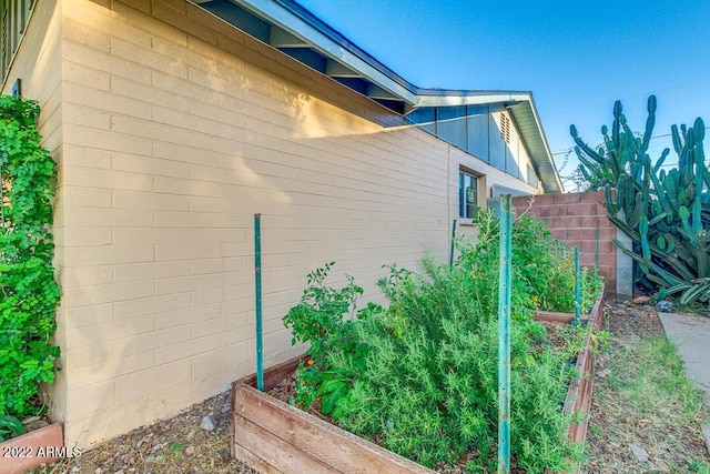 803 W 18th St, Tempe, AZ 85281 - view of home's exterior with a garden and concrete block siding