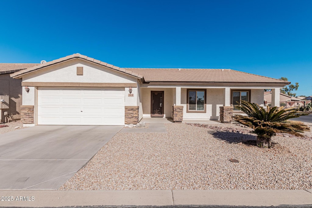 ranch-style home featuring a garage