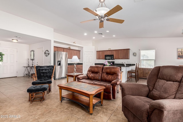 tiled living room featuring ceiling fan and high vaulted ceiling