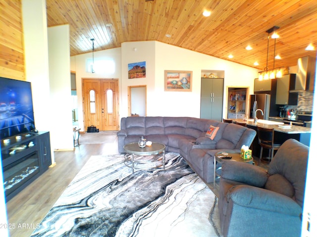 living area with light wood-type flooring, wood ceiling, and high vaulted ceiling