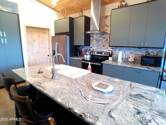 kitchen featuring electric range, stainless steel fridge with ice dispenser, wall chimney exhaust hood, black microwave, and a sink