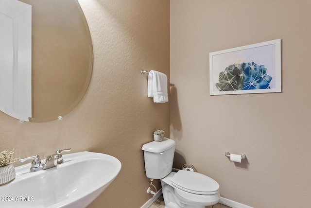 bathroom with toilet and sink