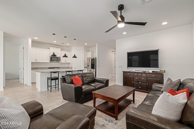 living area with recessed lighting and a ceiling fan
