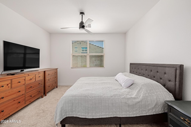 bedroom with light colored carpet and ceiling fan