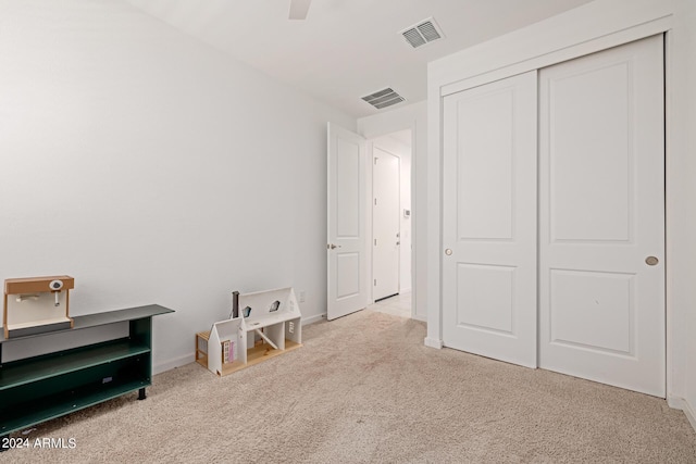 bedroom with carpet floors, baseboards, a closet, and ceiling fan