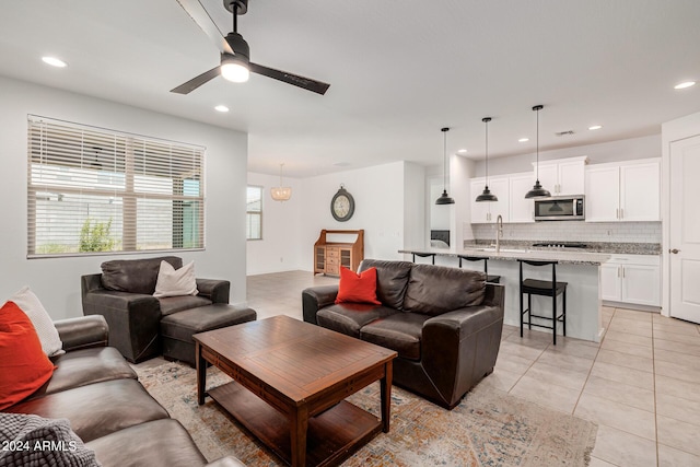 living room with ceiling fan, light tile patterned floors, and recessed lighting