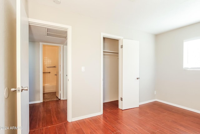 6219 S 12th Pl, Phoenix, AZ 85042 - unfurnished bedroom with wood finished floors and a closet