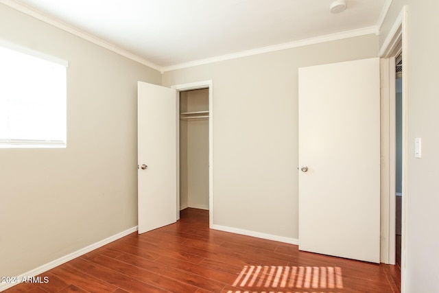 6219 S 12th Pl, Phoenix, AZ 85042 - unfurnished bedroom featuring ornamental molding, wood finished floors, and a closet