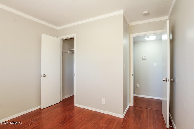 6219 S 12th Pl, Phoenix, AZ 85042 - unfurnished bedroom featuring wood finished floors, a closet, and ornamental molding