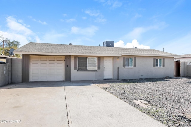 6219 S 12th Pl, Phoenix, AZ 85042 - ranch-style home with driveway, a garage, and stucco siding