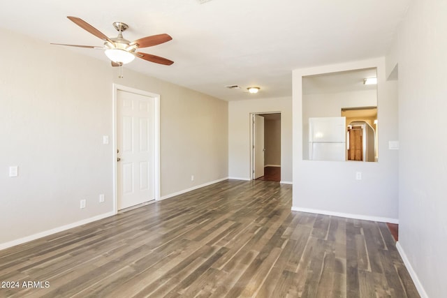 6219 S 12th Pl, Phoenix, AZ 85042 - empty room with a ceiling fan and dark wood-type flooring