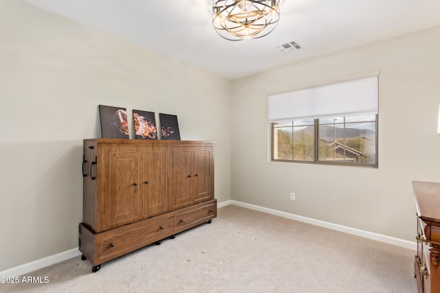 bedroom featuring light carpet, visible vents, and baseboards