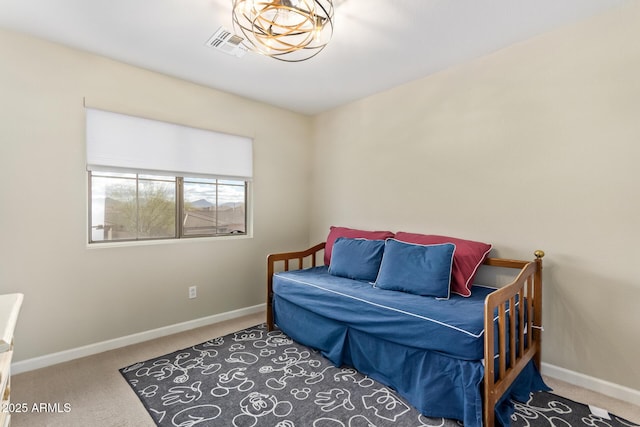 carpeted bedroom with visible vents and baseboards