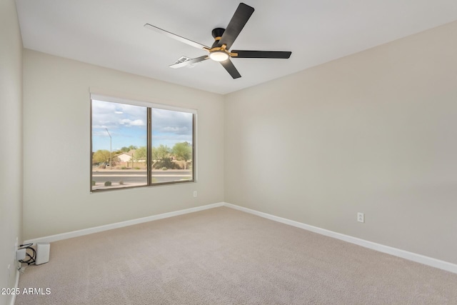 unfurnished room with ceiling fan, carpet flooring, and baseboards