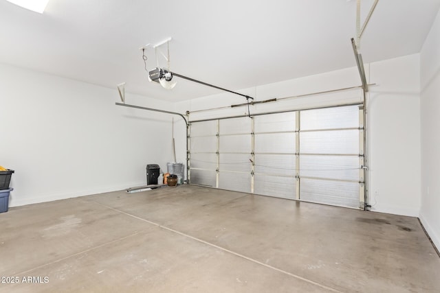 garage featuring baseboards and a garage door opener