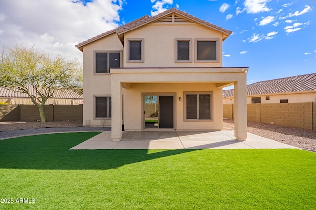 back of house with a patio area, a fenced backyard, a lawn, and stucco siding