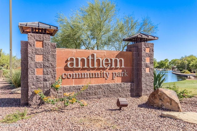 community sign with a water view