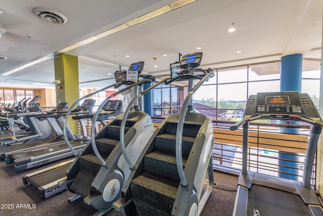 workout area with recessed lighting, visible vents, and plenty of natural light