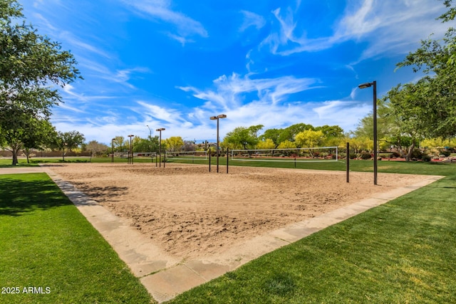 surrounding community featuring volleyball court and a yard