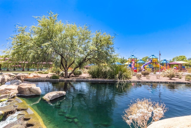 view of swimming pool with playground community