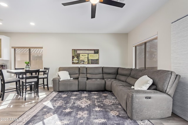 living room featuring ceiling fan, wood finished floors, and recessed lighting