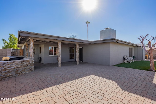 rear view of house featuring a patio area