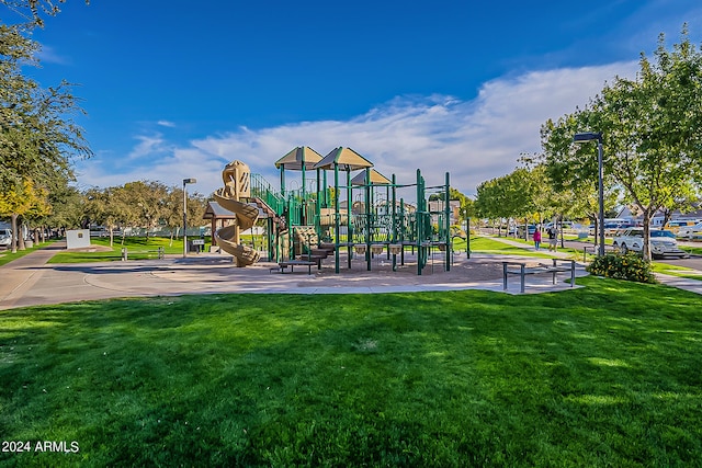 view of jungle gym with a lawn