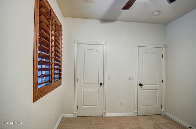 unfurnished bedroom featuring ceiling fan and carpet flooring