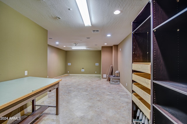 interior space featuring a textured ceiling